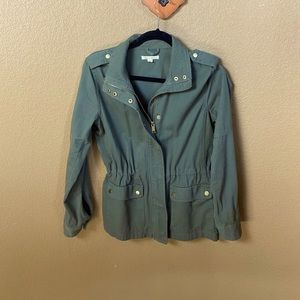 Army green jean jacket.   Zippered front & snaps.